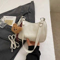 Creamy white PU underarm pillow bag with brown bear charm and long crossbody strap - White with Pendant