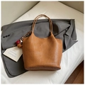 Brown woven leather bucket bag with top handles and decorative pompom charm - Brown with Pendant