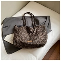 Large leopard print canvas tote bag with orange label on gray blazer suit backdrop - Grey Leopard Print