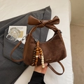 Minimalist dark brown suede underarm bag with large leather bow and beaded tassel - With Charm / Brown