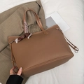 Brown litchi grain faux leather tote bag with silk scarf on a beige blazer background - Brown
