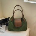 Detail of spacious dark green suede tote bag with brown leather straps for commuting - Green