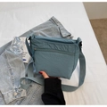 Close-up of greyish-blue washed canvas crossbody bag with textured wrinkled fabric - One Size / Fog Blue