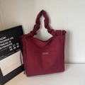 Retro wine red suede bucket bag featuring cloud-style pleated handle and side tie detail - Burgundy