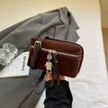 Brown vintage square crossbody bag with suede texture and a unique robot pendant detail - Coffee