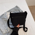Minimalist black canvas crossbody bag with adjustable strap and zipper pocket - Black