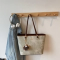 Olive green tote bag with vintage texture and cute plush charm on a wooden hanger - Khaki Brown With Pendant