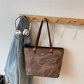 Vintage brown leather tote bag with marble pattern for women on a wooden hanger - Coffee without Pendant