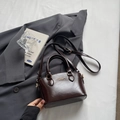 Dark brown glossy leather Boston bag with dual handles and a long shoulder strap - Coffee No Charm