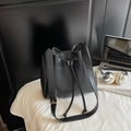 Chic black drawstring bucket bag with gold hardware and wide adjustable shoulder strap - Black without Pendant