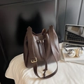 Chic dark brown faux leather bucket bag with adjustable wide strap and drawstring closure - Coffee No Charm