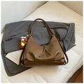 Detail of vintage brown tote bag with leather texture and cute plush bear charm - Brown with Pendant