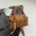 Brown suede Boston handbag with vintage embossing and colorful beaded charm strap - Brown