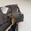 Minimalist charcoal grey boston bag with top handles and beaded tassel detail - Black
