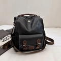 Vintage black and brown leather backpack with retro buckle pocket and chic urban style - Black