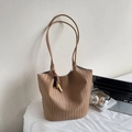 Detail of hand-woven tote bag in dark khaki leather with boho beaded pendant charm - Khaki With Pendant