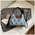 Detailed view of blue tote bag with brown leather straps and cute teddy bear charm - With Pendant / Blue with Pendant