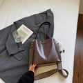 Deep brown bucket bag with a plush charm and decorative woven shoulder strap - Coffee with Pendant
