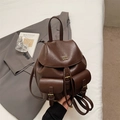Vintage dark brown leather backpack with gold hardware and dual front pockets - Brown