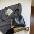 Minimalist black bucket bag with textured leather and patterned fabric strap - Black without Pendant