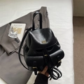 Classic black faux leather backpack with gold buckle pockets and drawstring closure - Black