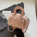 Pink faux fur crossbody bag with top handles and adjustable strap in a stylish aesthetic - Pink