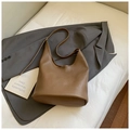 Brown litchi leather bucket bag in a soft hobo silhouette with slim shoulder strap - Brown