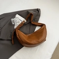 Brown faux leather crescent moon dumpling bag with wide shoulder strap and silver buckle - Brown