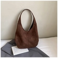 Detailed close-up of dark brown suede hobo bag featuring laser-cut floral patterns on fabric - Brown