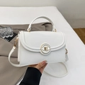 Detail of white lychee pattern faux leather crossbody bag with golden round metal clasp - White