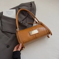 Vintage brown cylindrical shoulder bag with glossy finish and silver buckle detail - Brown