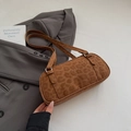 Chic brown leopard print cylindrical underarm bag with embossed branding and silver hardware - Brown No Pendant