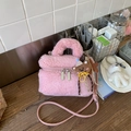 Detailed view of pink plush crossbody bag with furry handle and cute brown bear pendant - Light Pink With Charm