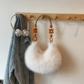 White fluffy shoulder bag featuring orange beads and woven rope handle in boho style - Off White