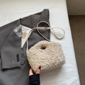Detail of cream-white faux shearling handbag with round handle and adjustable strap - Khaki