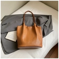 Close-up of caramel brown woven leather texture on a minimalist commute tote bag - Brown No Pendant