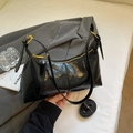 Elegant black glossy pleated baguette bag with gold hardware and adjustable strap - Black