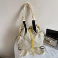 Detail of a minimalist cream nylon tote backpack with yellow drawstring and side pocket - Off White