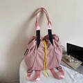 Pink nylon drawstring backpack with yellow cords and laptop for school use - Pink