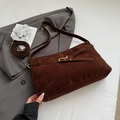 Detail of dark brown faux suede tote bag with decorative straps and gold metal hook - Brown