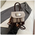 Detail of vintage canvas and patent leather backpack with drawstring and tassel accent - Grey With Pendant