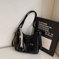 Elegant black glossy leather tote bag with woven pendant and side embossed lettering - Black