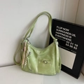 Light green hobo shoulder bag with washed leather texture and tassel charm - Green