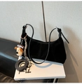 Detail of black suede crescent hobo bag with plush charm and detachable shoulder strap - Black With Pendant
