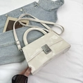 Glossy white patent leather trapezoid handbag with silver twist lock and strap - Off White