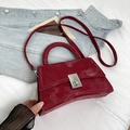 Chic burgundy patent leather handbag with hourglass base and silver metal twist lock - Red