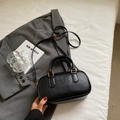 Matte black leather bowling handbag with gold hardware and Mira Mira embossed lettering - Style Without Charm / Black