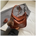 Dark brown shiny leather satchel with wide strap and furry ball charm accessory - Brown with Pendant