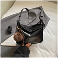 Retro black semi-circle bag with glossy finish and detachable shoulder strap with tassel - Black with Pendant