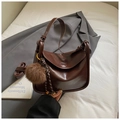 Deep brown glossy leather crossbody bag with adjustable strap and plush charm - Coffee with Pendant